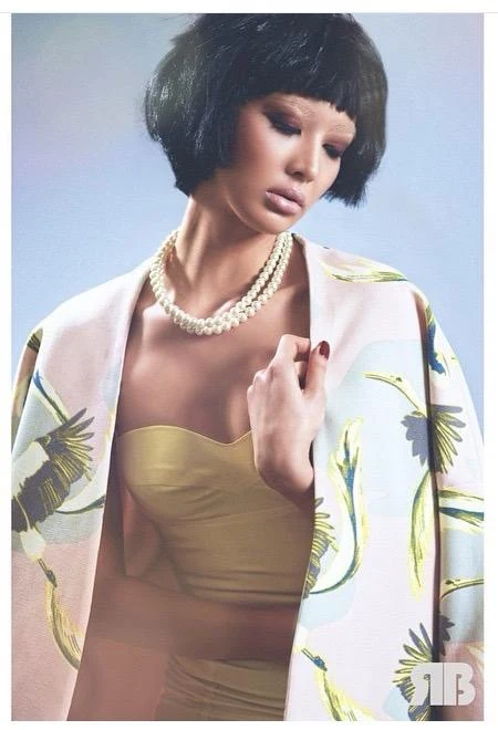 Short dark bob, pearl jewellery and a softly coloured beauty look