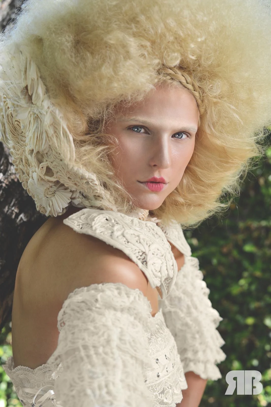 Period-inspired beauty look with a pale sculpted hairstyle and lace